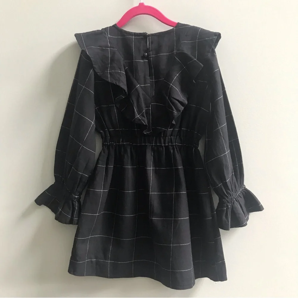 Nueces ruffled black dress, size 6A.